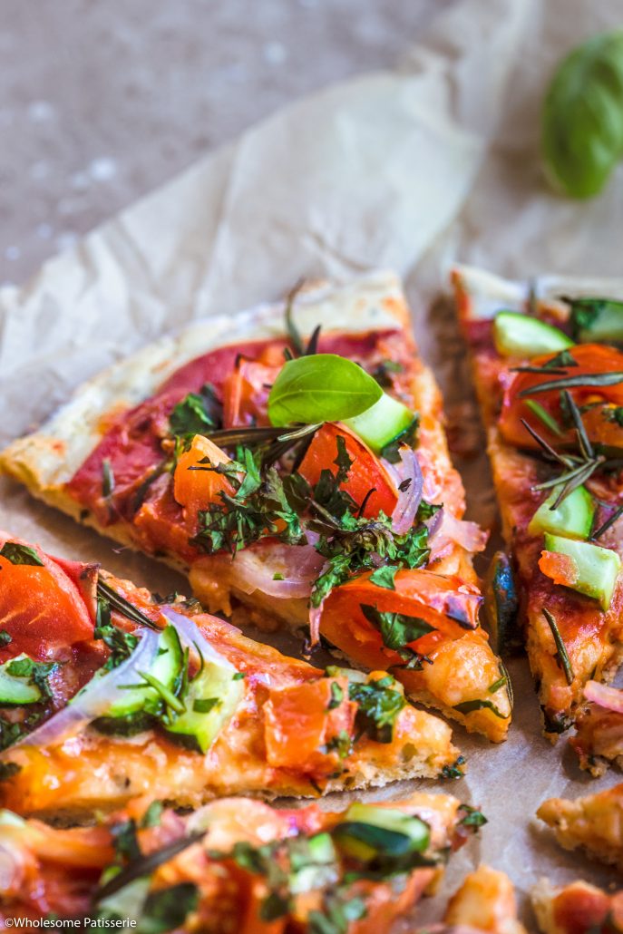 Gluten Free Pizza! Simple homemade pizza base topped with fresh, bursting with flavour veggies + herbs! #glutenfreepizza #glutenfree #pizza #vegetarianpizza