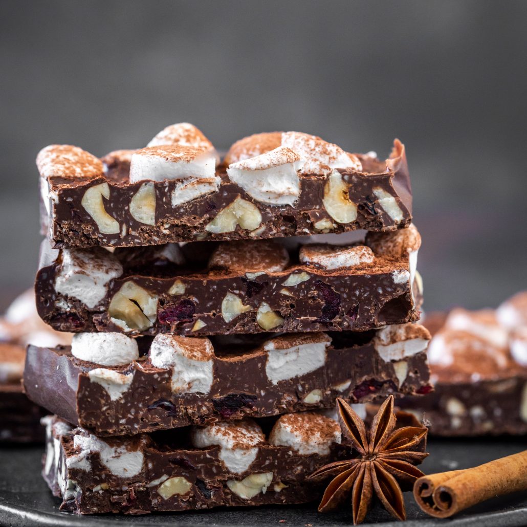 Chai Spiced Rocky Road Bark! Traditional chai spices blended through dark chocolate and combined with coconut, hazelnuts and dried cranberries. Sprinkled with mini marshmallows and a dusting of cocoa powder, yay!