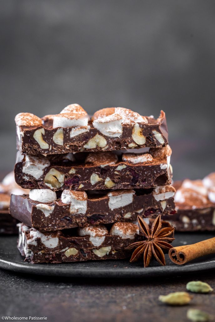 Chai Spiced Rocky Road Bark! Traditional chai spices blended through dark chocolate and combined with coconut, hazelnuts and dried cranberries. Sprinkled with mini marshmallows and a dusting of cocoa powder, yay! 