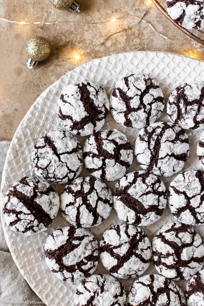 Chocolate Crinkle Cookies! Fudgy chocolate cookie dough rolled in snow white icing sugar! Perfect for your at home Christmas baking!