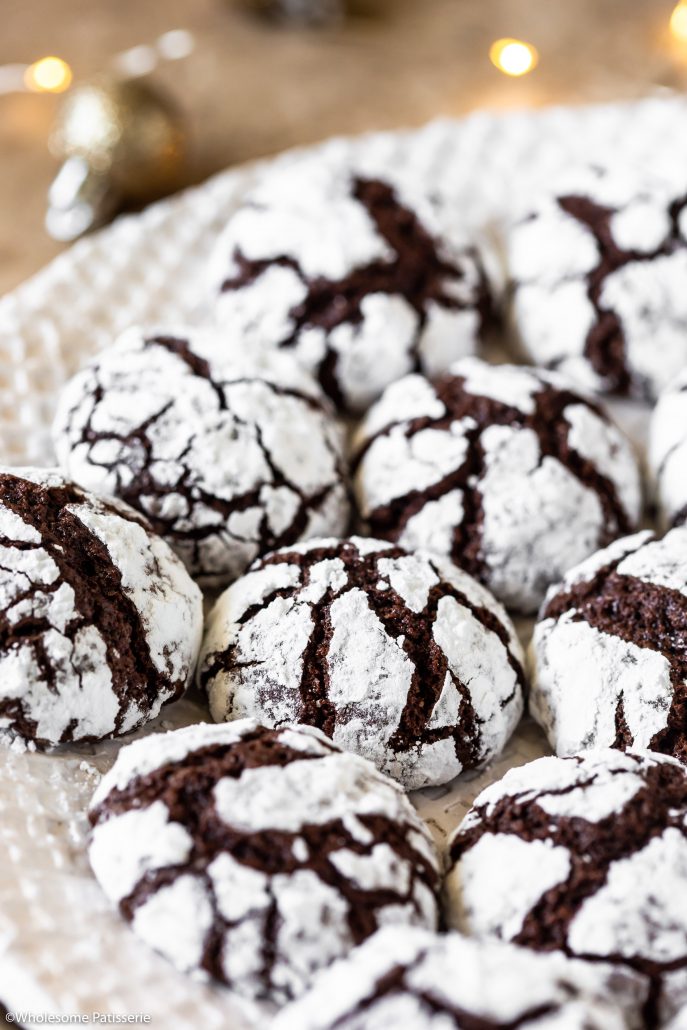 Chocolate Crinkle Cookies! Fudgy chocolate cookie dough rolled in snow white icing sugar! Perfect for your at home Christmas baking!