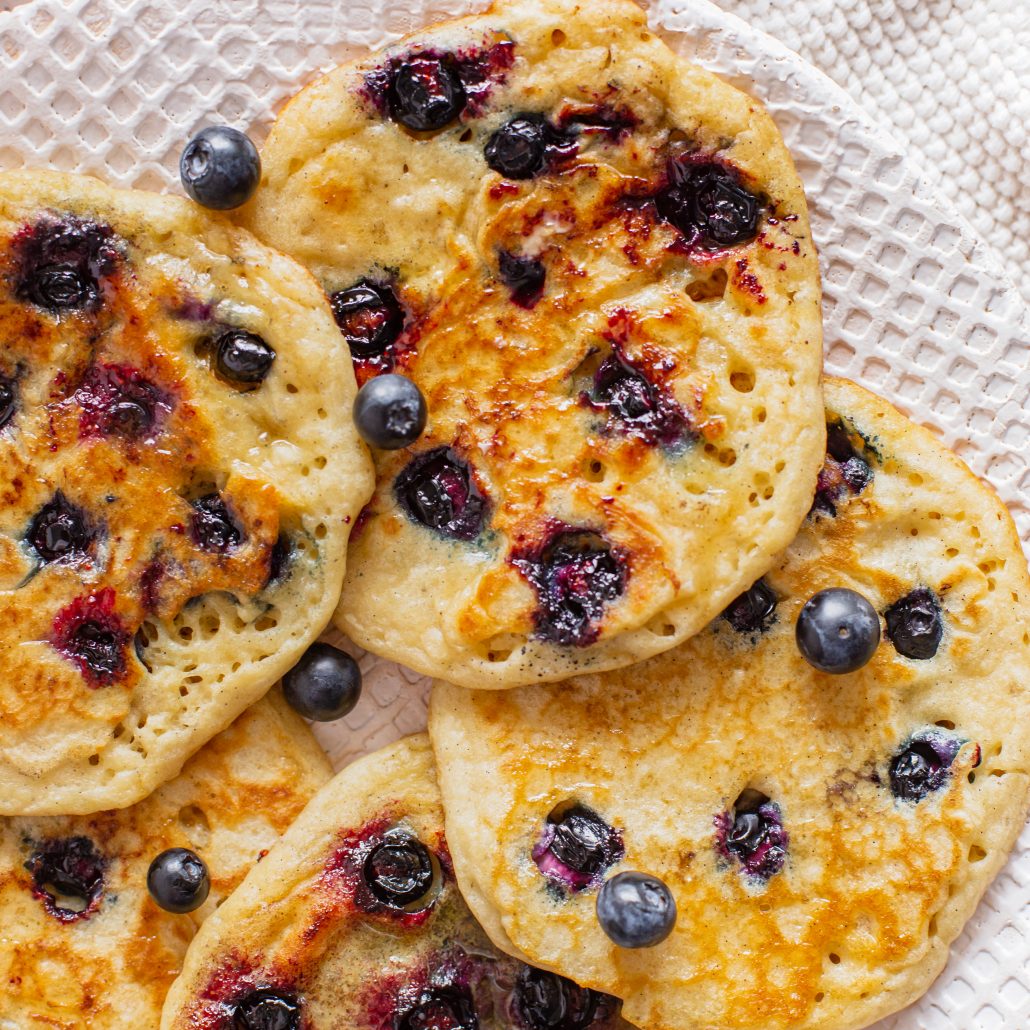 Classic Gluten Free Blueberry Pancakes! Fluffy golden and bursting with blueberries! Made using gluten free flour, your new perfect Sunday morning breakfast!