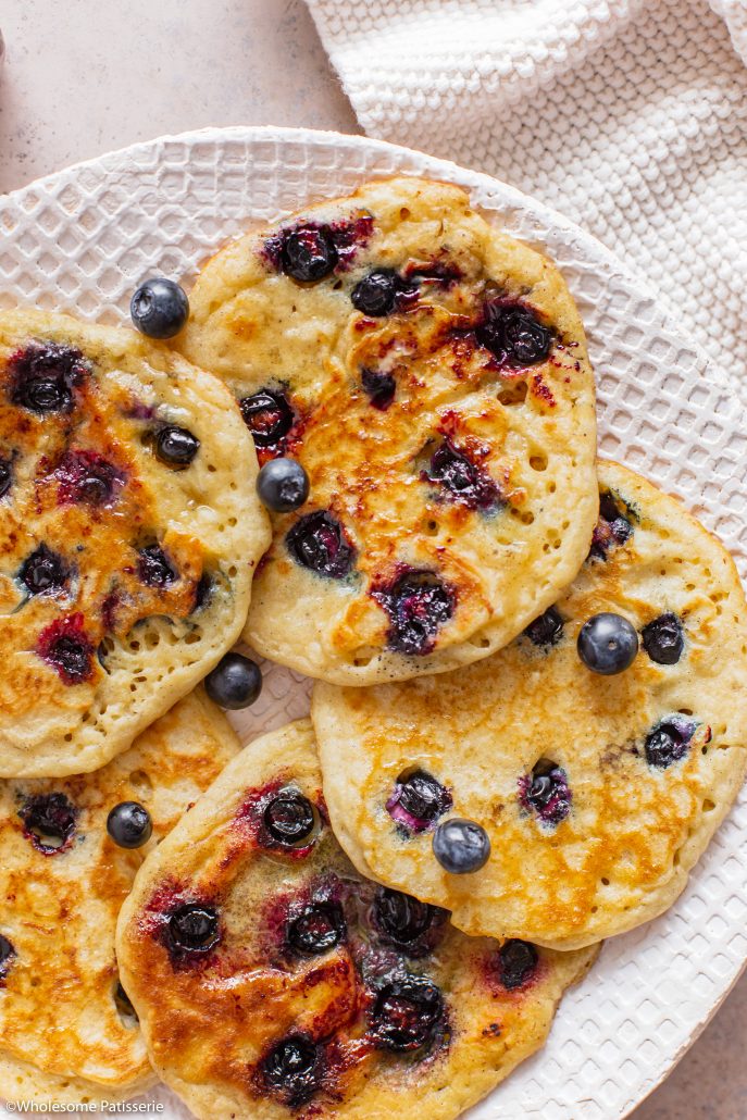 Classic Gluten Free Blueberry Pancakes! Fluffy golden and bursting with blueberries! Made using gluten free flour, your new perfect Sunday morning breakfast! 