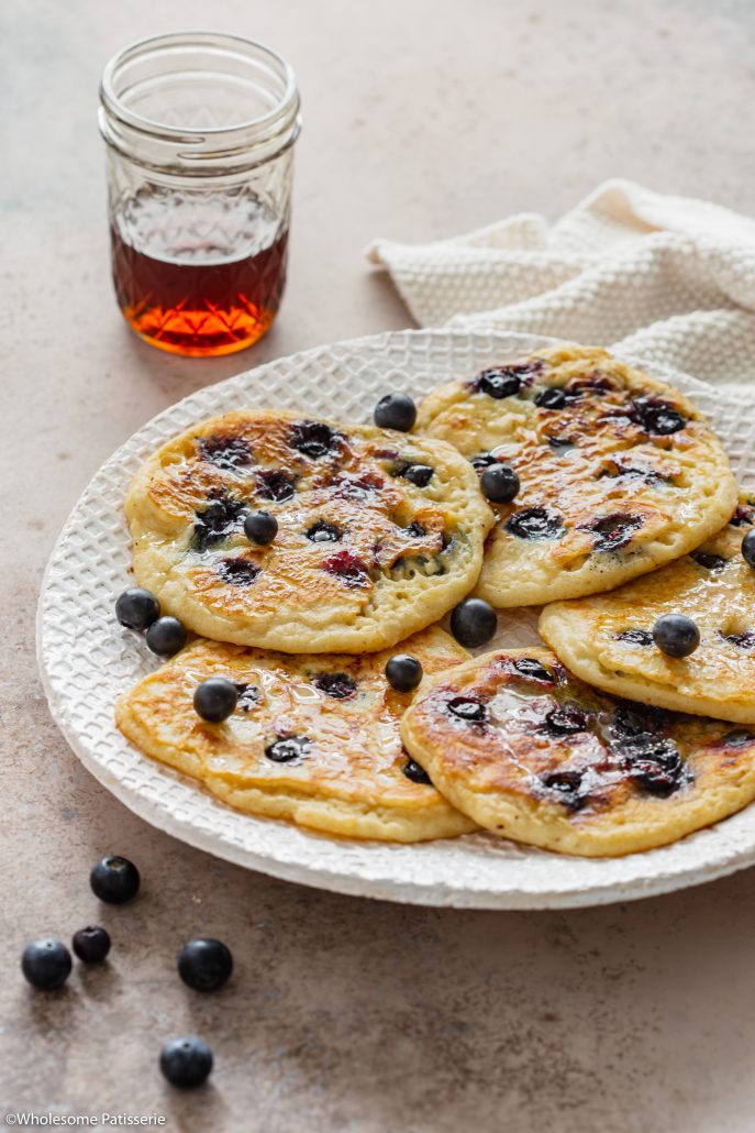 Classic Gluten Free Blueberry Pancakes! Fluffy golden and bursting with blueberries! Made using gluten free flour, your new perfect Sunday morning breakfast! 