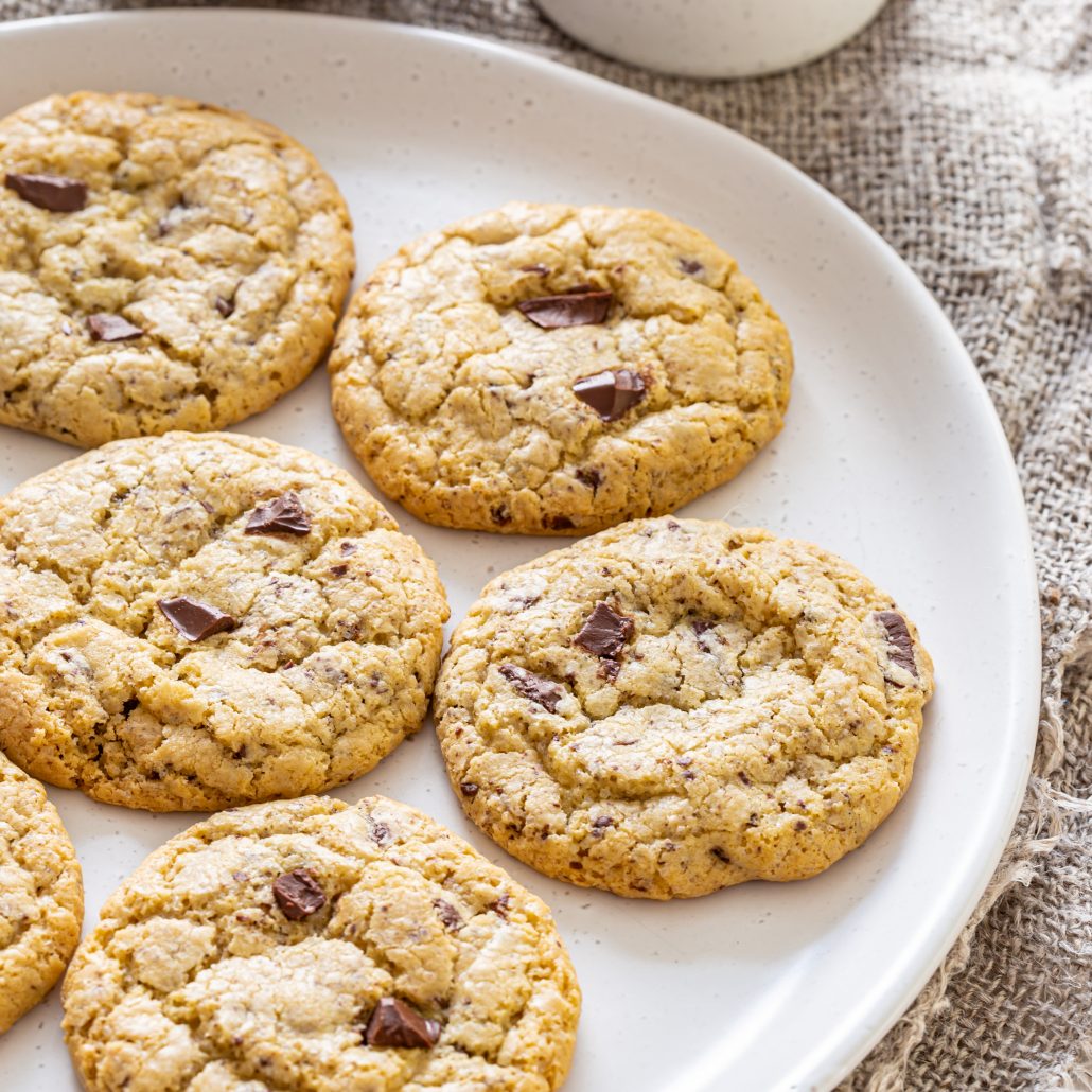 Gluten Free Chocolate Chunk Cookies! These cookies are your classic crisp on the outside, soft and gooey on the inside kind of cookie. With soft and melty chocolate chunks throughout!