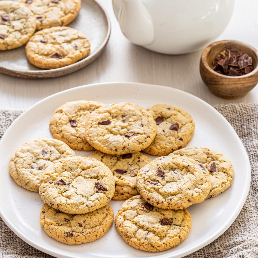 Gluten Free Chocolate Chunk Cookies! These cookies are your classic crisp on the outside, soft and gooey on the inside kind of cookie. With soft and melty chocolate chunks throughout!