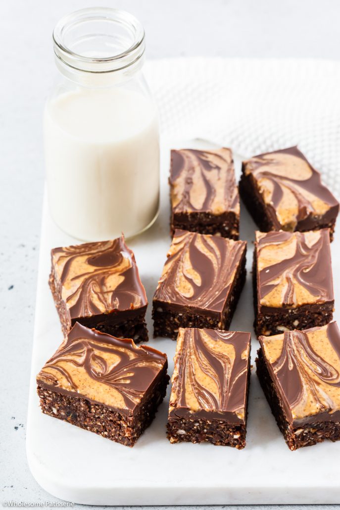 No-Bake Almond & Chia Chocolate Brownies! Rich, decadent and healthier for you brownies! These are no-bake brownies topped with a luscious melted dark chocolate brownies with an almond butter swirl. Enjoy with your morning cup of tea or after dinner snack. 