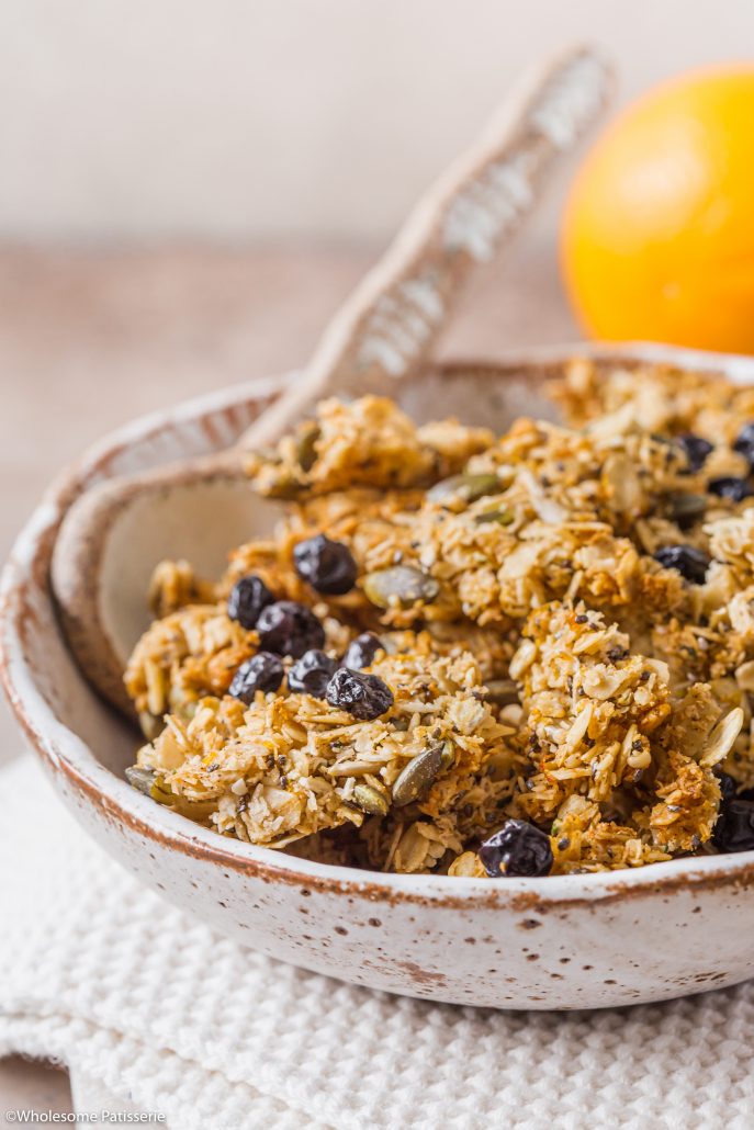 Orange & Blueberry Seeded Granola! Wholesome and flavourful orange infused homemade granola. Loaded with seeds and free from nuts! Turns out chunky which is perfect to top your yoghurt and berries or serve with milk and enjoy! 