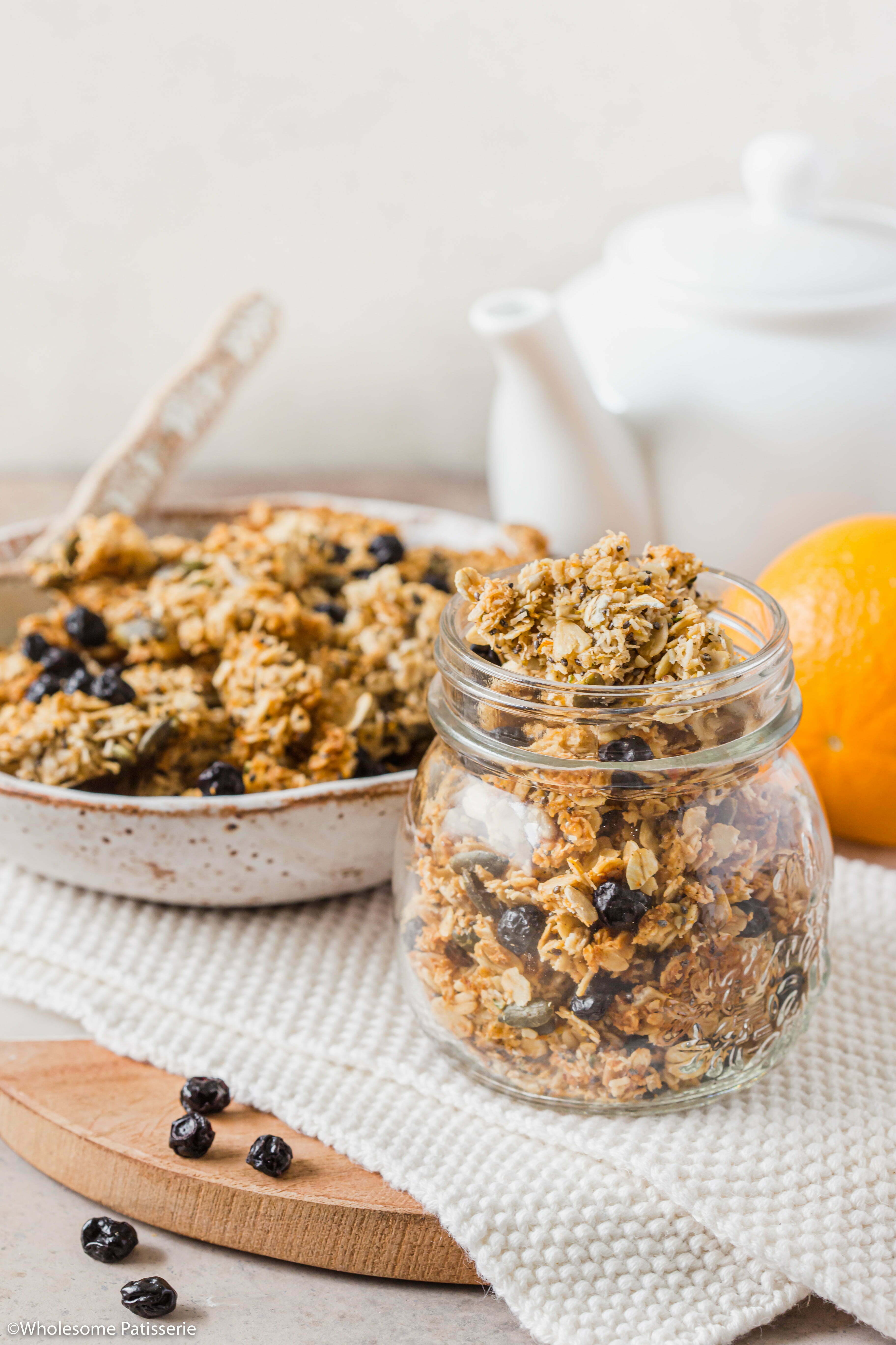 Orange & Blueberry Seeded Granola! Wholesome and flavourful orange infused homemade granola. Loaded with seeds and free from nuts! Turns out chunky which is perfect to top your yoghurt and berries or serve with milk and enjoy!