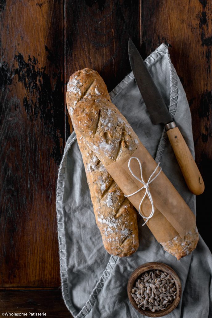 Seeded Baguettes! Homemade baguettes filled with sunflower, sesame and poppy seeds. The dough itself is simple and created in one bowl. A couple hours of resting and rising time then they’re baked until golden and crisp. Serve warm straight from the oven with a dollop of butter! 