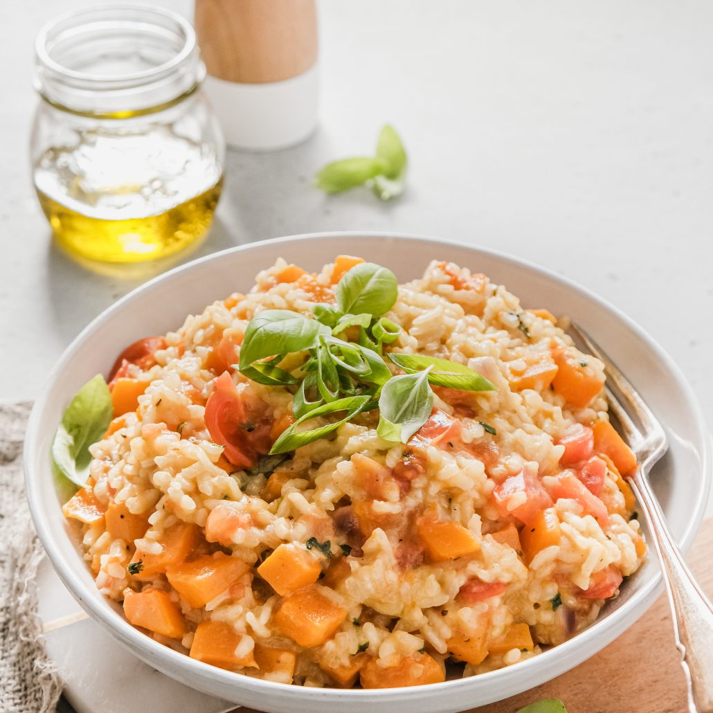 Pumpkin & Cherry Tomato Risotto! Creamy vegetarian risotto, homemade and glorious! Filled with pumpkin, bursting cherry tomatoes, spring onion and fresh basil!