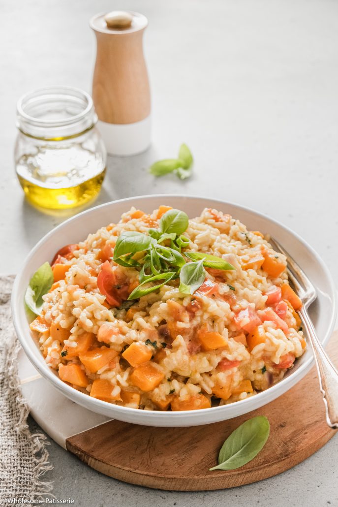 Pumpkin & Cherry Tomato Risotto! Creamy vegetarian risotto, homemade and glorious! Filled with pumpkin, bursting cherry tomatoes, spring onion and fresh basil! 