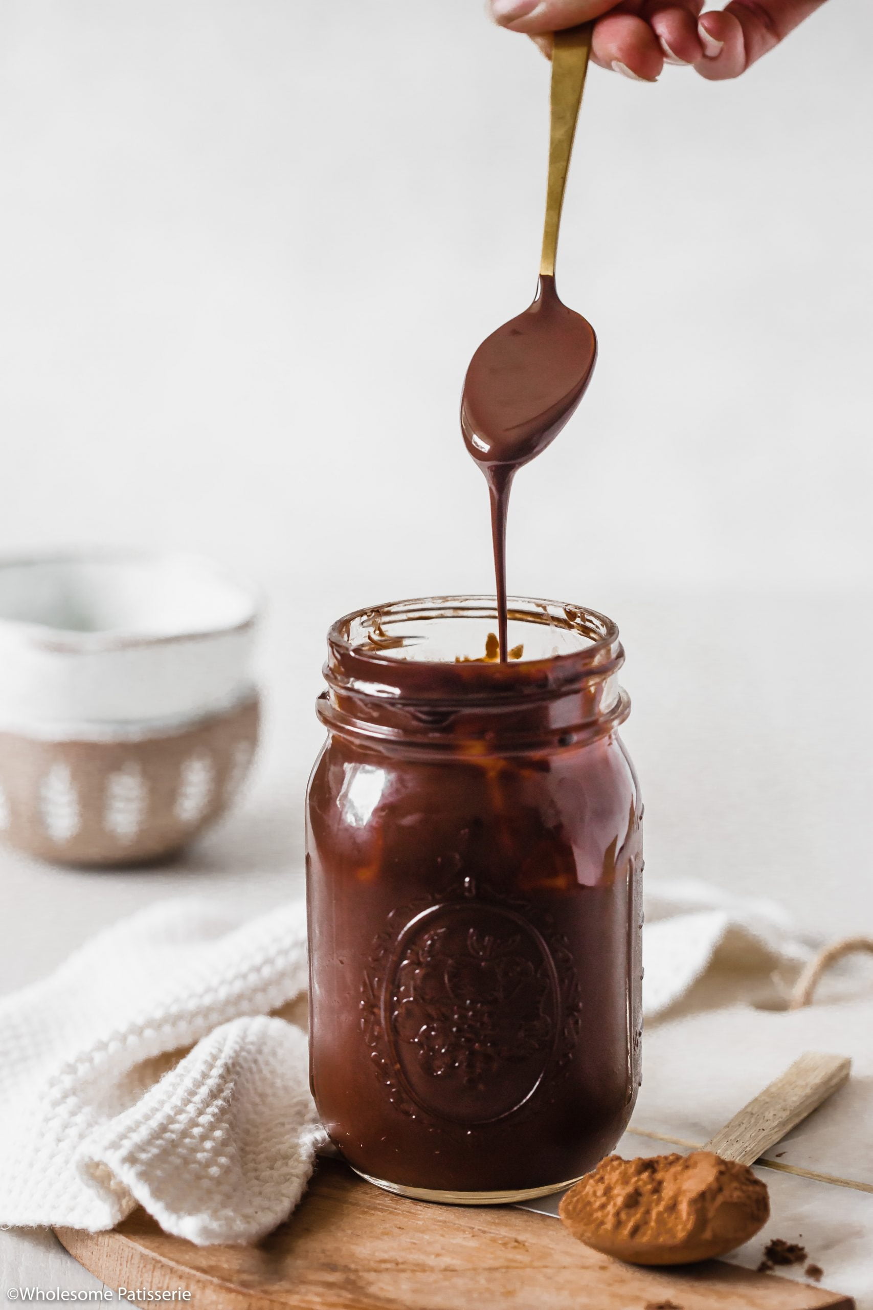 Showing the consistency of the finished chocolate sauce