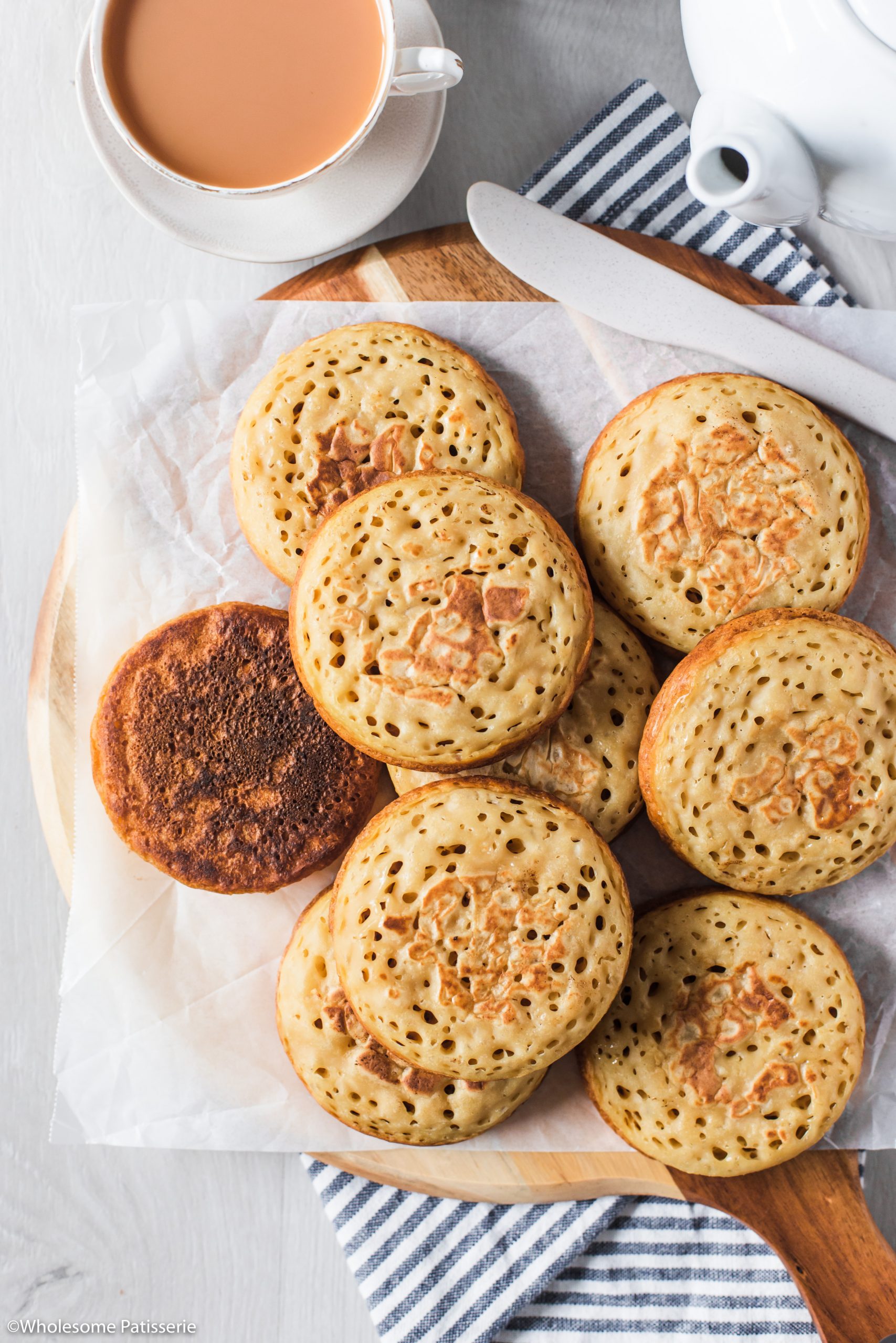 Preparing the crumpets for serving.