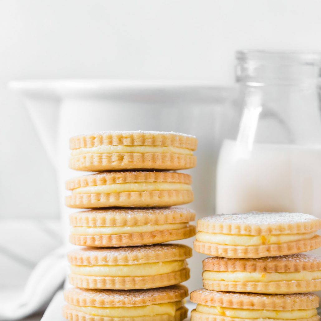 Orange cream biscuits stacked in a tall tower