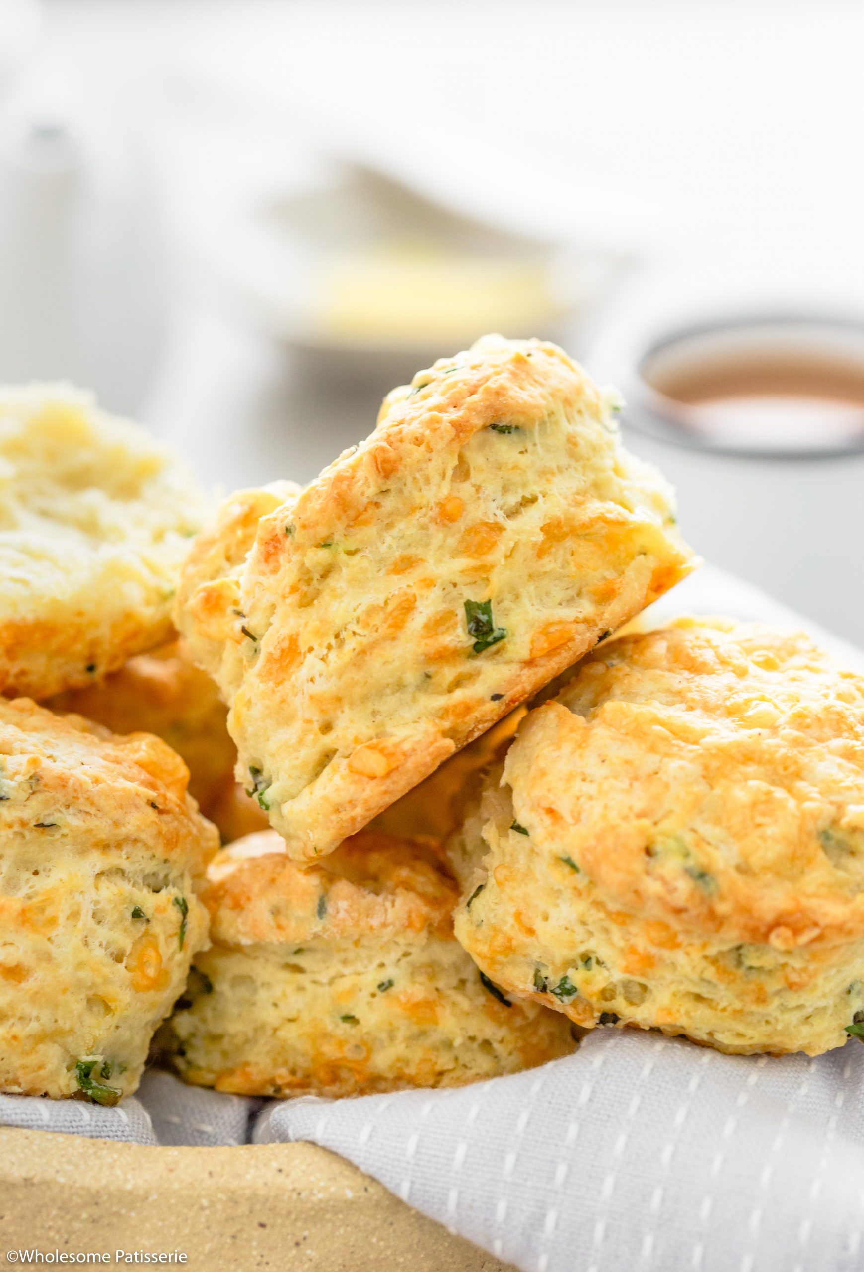 Baked cheese and chive scones close up image