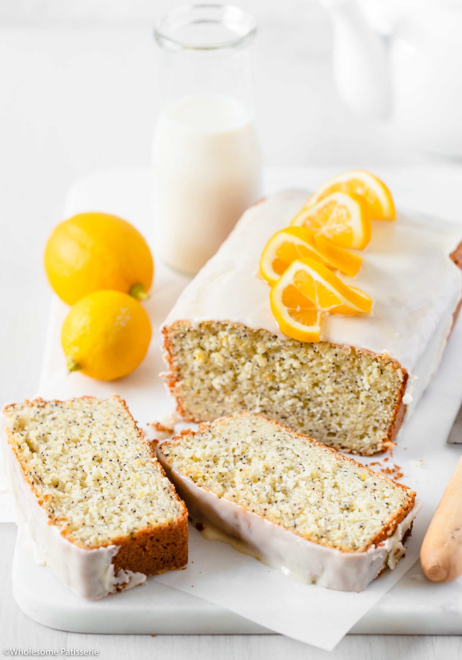 Lemon Poppy Seed Bread! A glorious classic loaf with beautiful poppy seeds that has been infused with a generous amount of grated lemon zest and freshly squeezed lemon juice. With a tender crumb yet sturdy crust, this loaf promises to offer a potent and bright lemon flavour and a slight crunch thanks to the poppy seeds. Drizzled with a 2-ingredient lemon icing which makes this bread next level scrumptious.