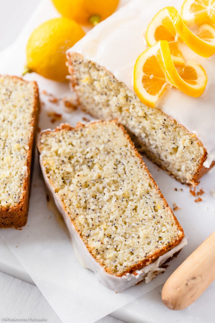 Lemon Poppy Seed Bread! A glorious classic loaf with beautiful poppy seeds that has been infused with a generous amount of grated lemon zest and freshly squeezed lemon juice. With a tender crumb yet sturdy crust, this loaf promises to offer a potent and bright lemon flavour and a slight crunch thanks to the poppy seeds. Drizzled with a 2-ingredient lemon icing which makes this bread next level scrumptious. 