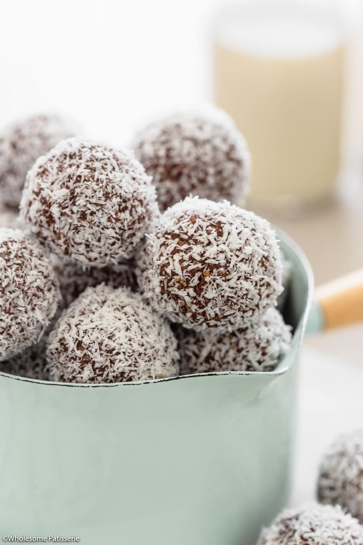 Super close up shot of the rum balls coated in coconut