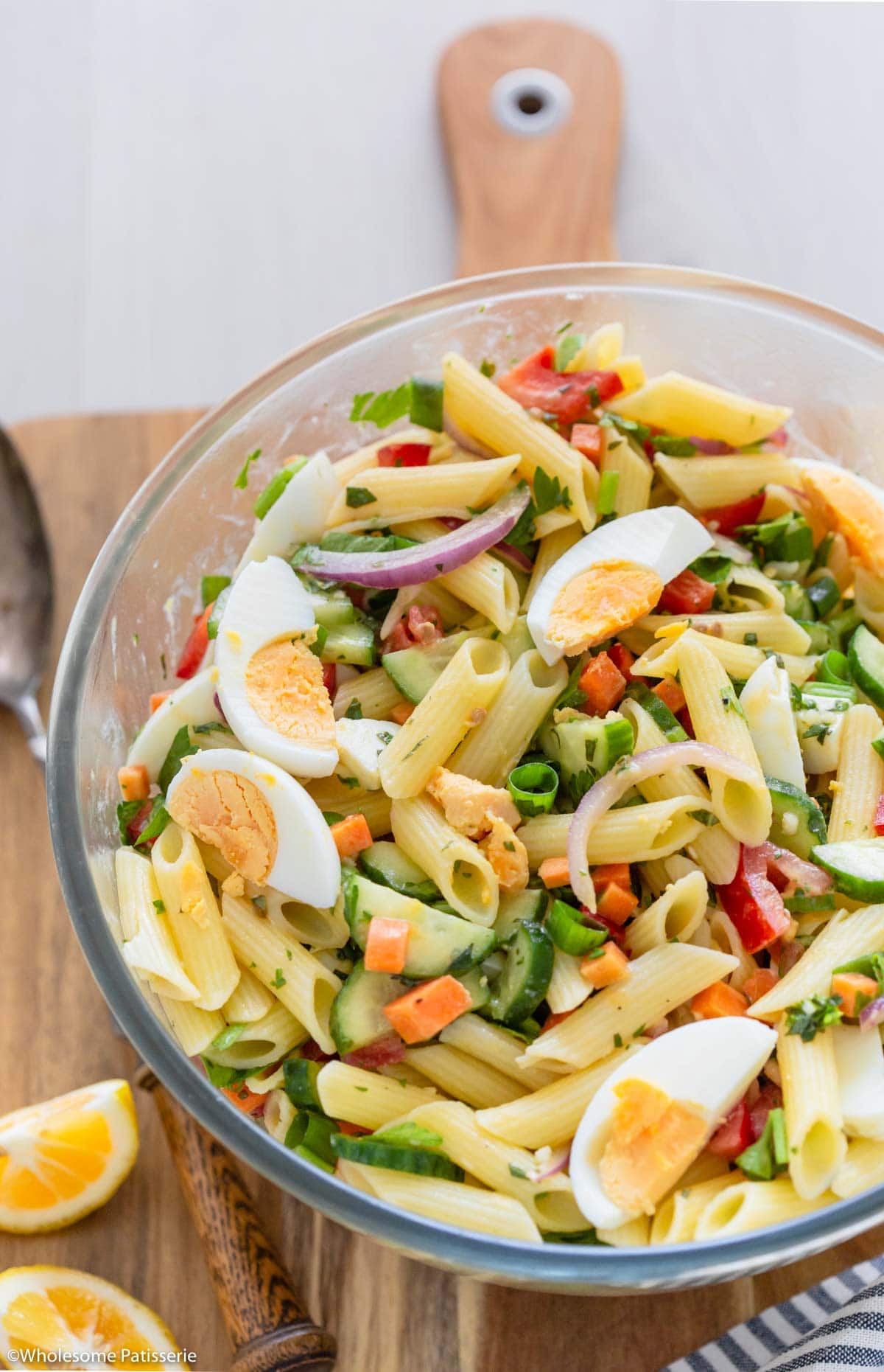 Close up image showing sliced egg and vegetables in salad ready to serve