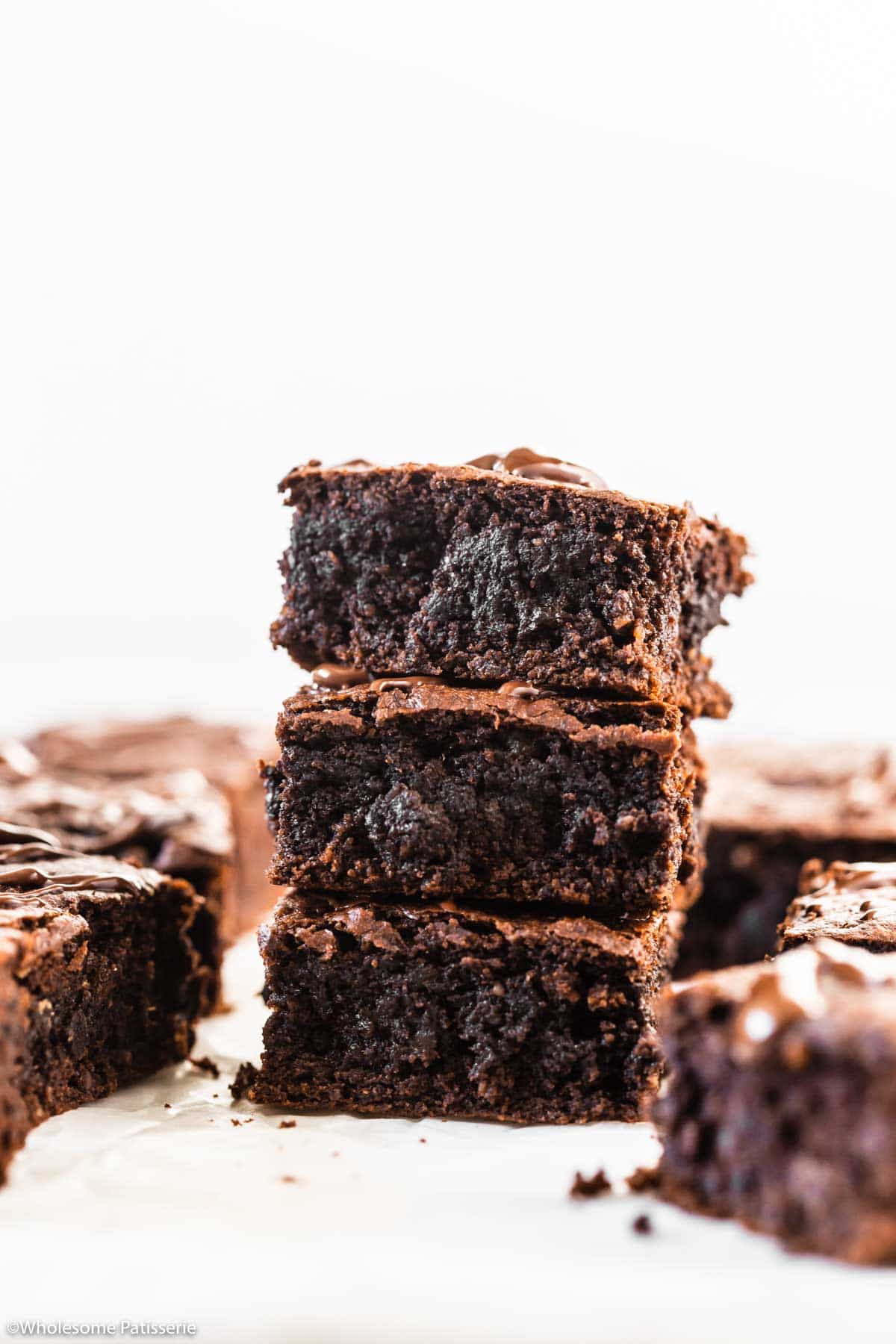 brownies stacked on top of each other to show the fudgy texture