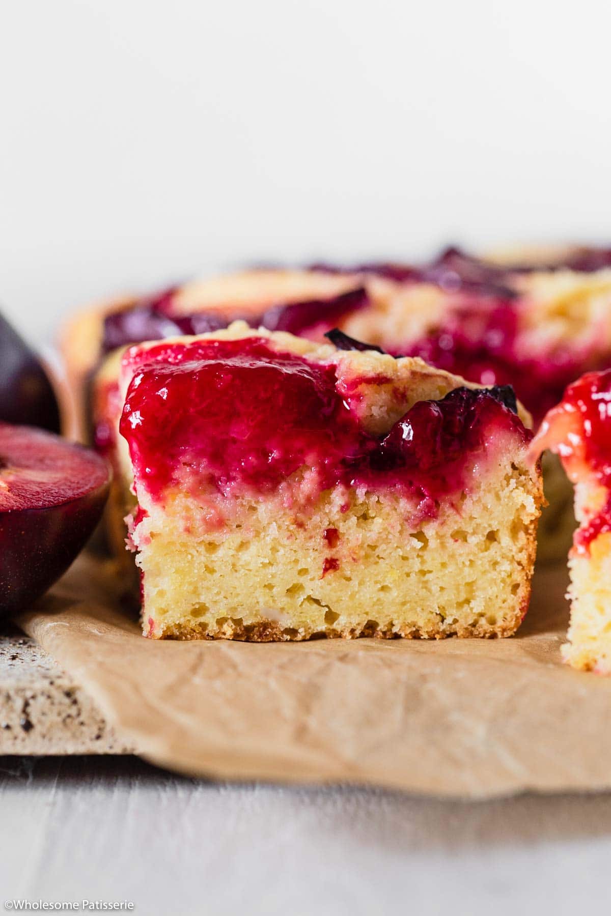 Slice of cake showing the juicy plums