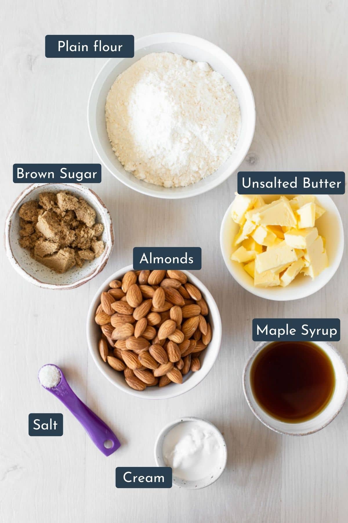 Ingredients in bowls that are needed to make this almond slice