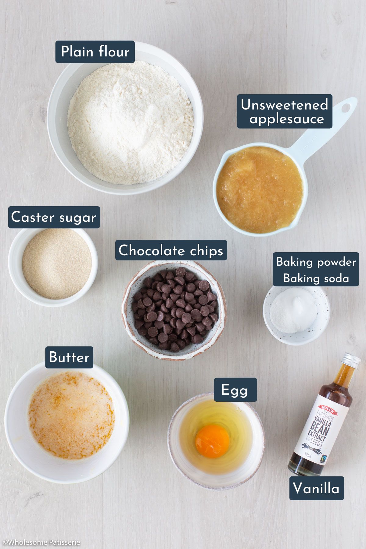 The ingredients you need to make these muffins are plain flour, unsweetened applesauce, caster sugar, chocolate chips, baking powder, baking soda, melted butter, egg and vanilla.