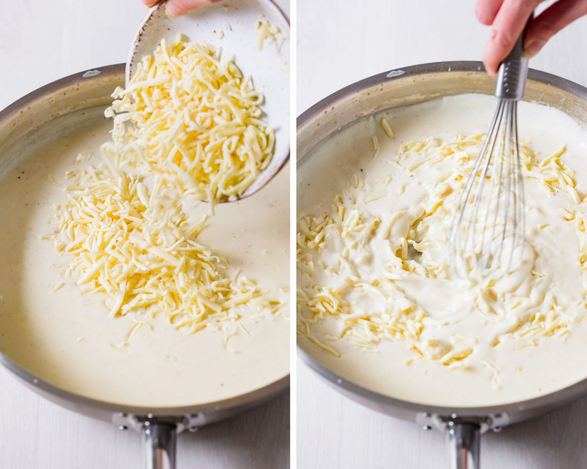 Adding shredded cheese and whisking it through the white sauce in the frying pan.