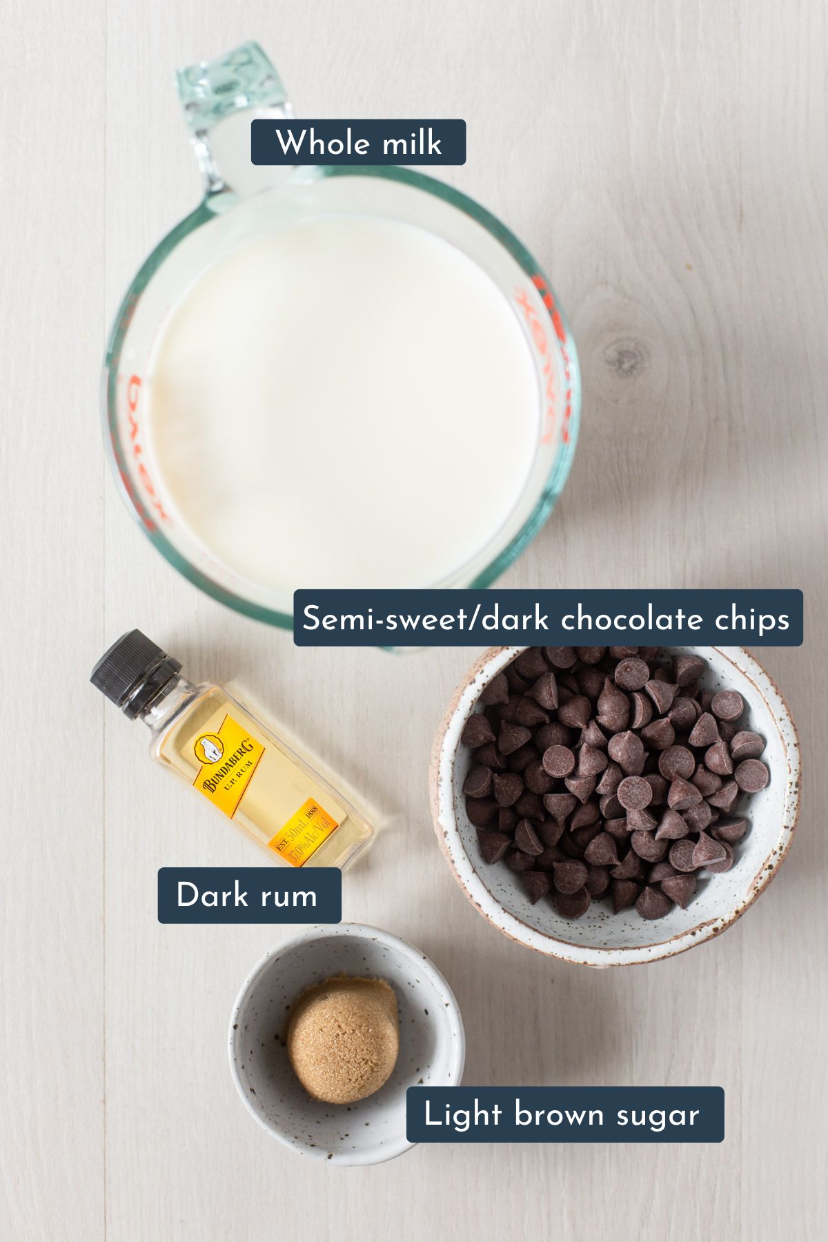 Ingredients to make rum hot chocolate are whole milk, semi-sweet/dark chocolate chips, dark rum and light brown sugar.