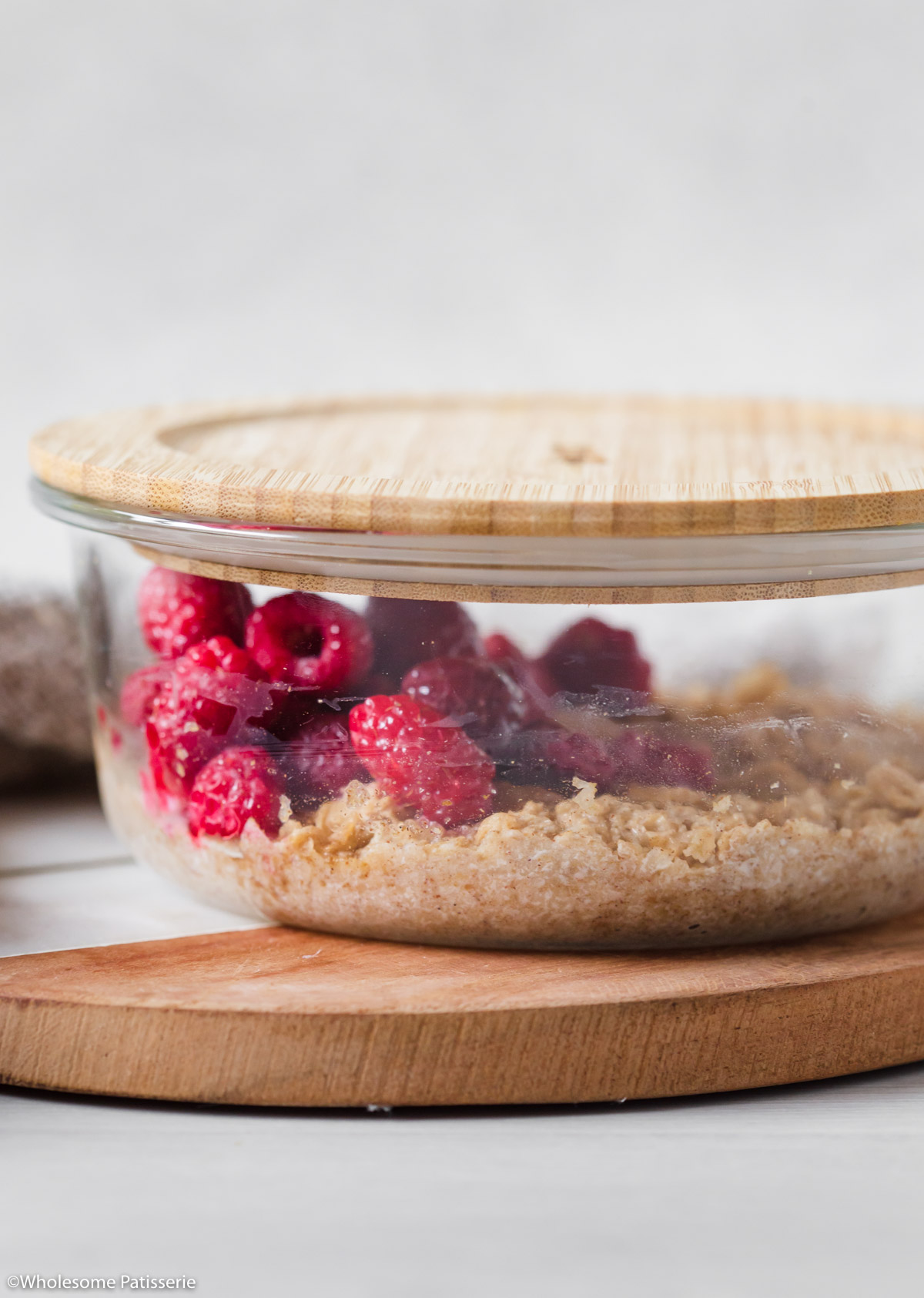 Soaked Weetabix in glass container with wooden lid on.