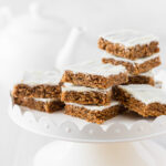 Weetbix slice cut into squares and stacked together on a display stand.