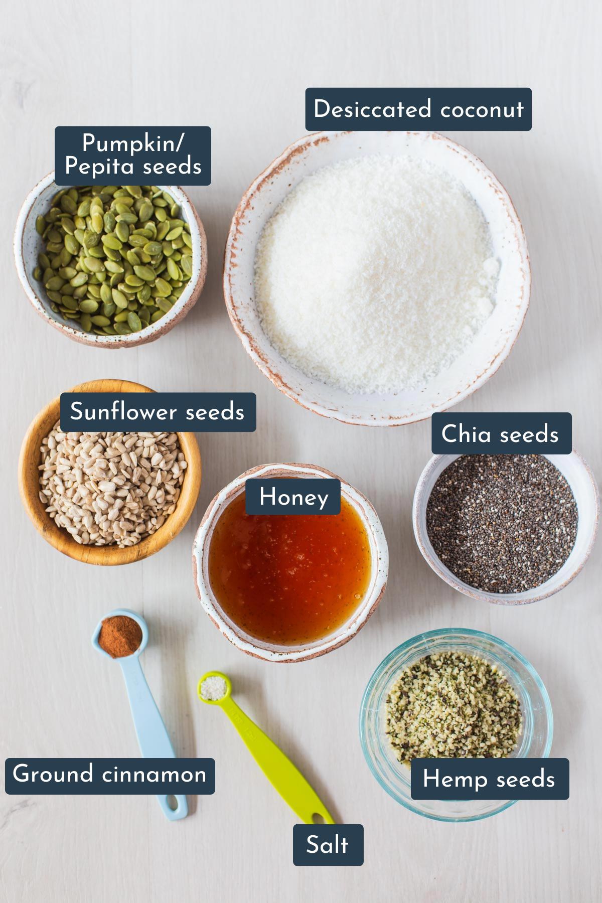 Ingredients to make seed bars is hemp seeds, sunflower seeds, chia seeds, pumpkin seeds, desiccated coconut, honey, ground cinnamon and salt.