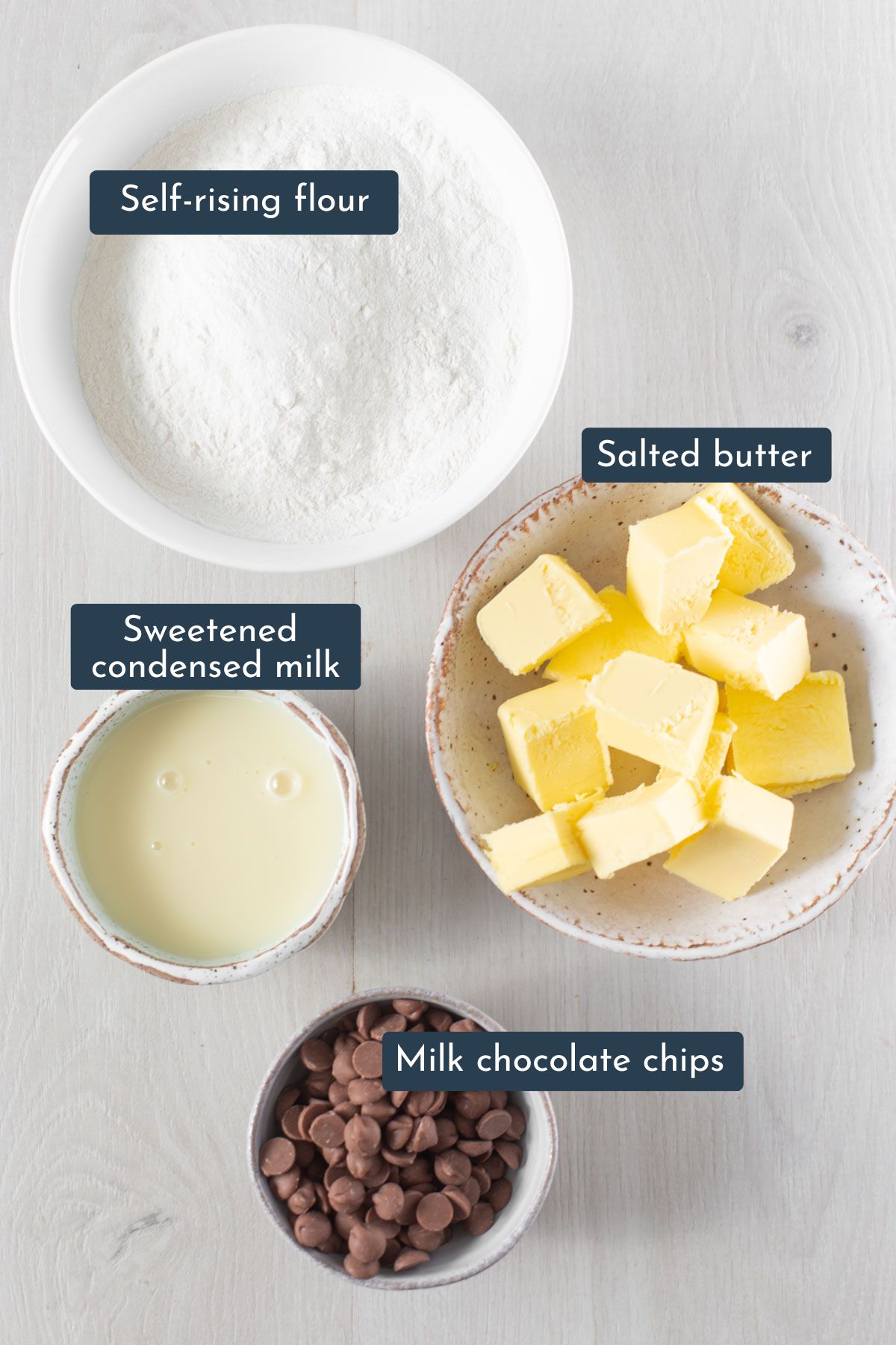 Ingredients to make condensed milk cookies are self-rising flour, salted butter, sweetened condensed milk, milk chocolate chips