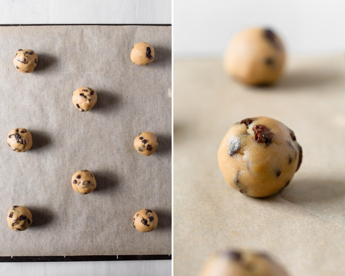 Cookie dough balls formed and placed on lined baking sheet ready to bake