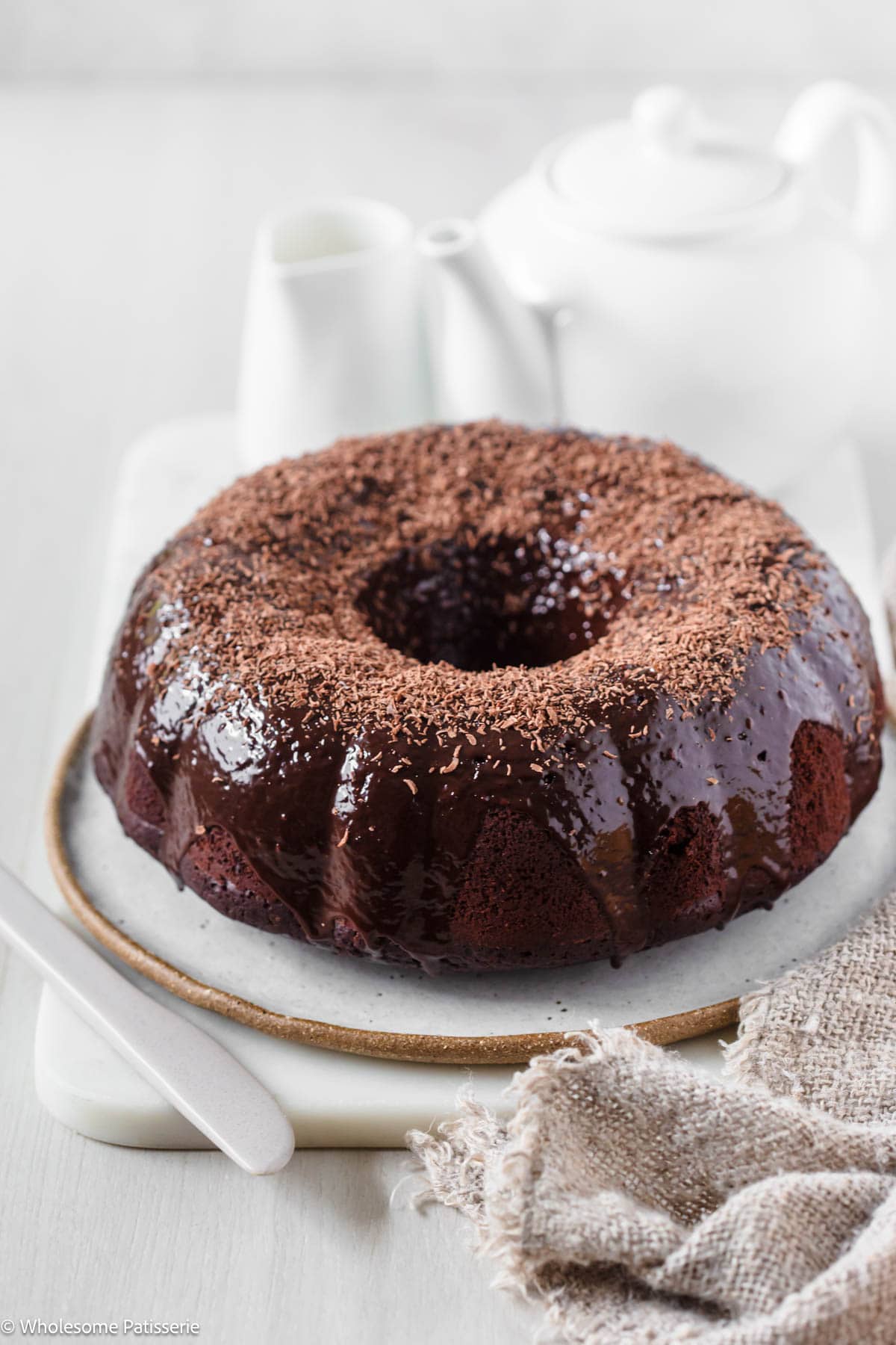 Chocolate bundt cake on plate.