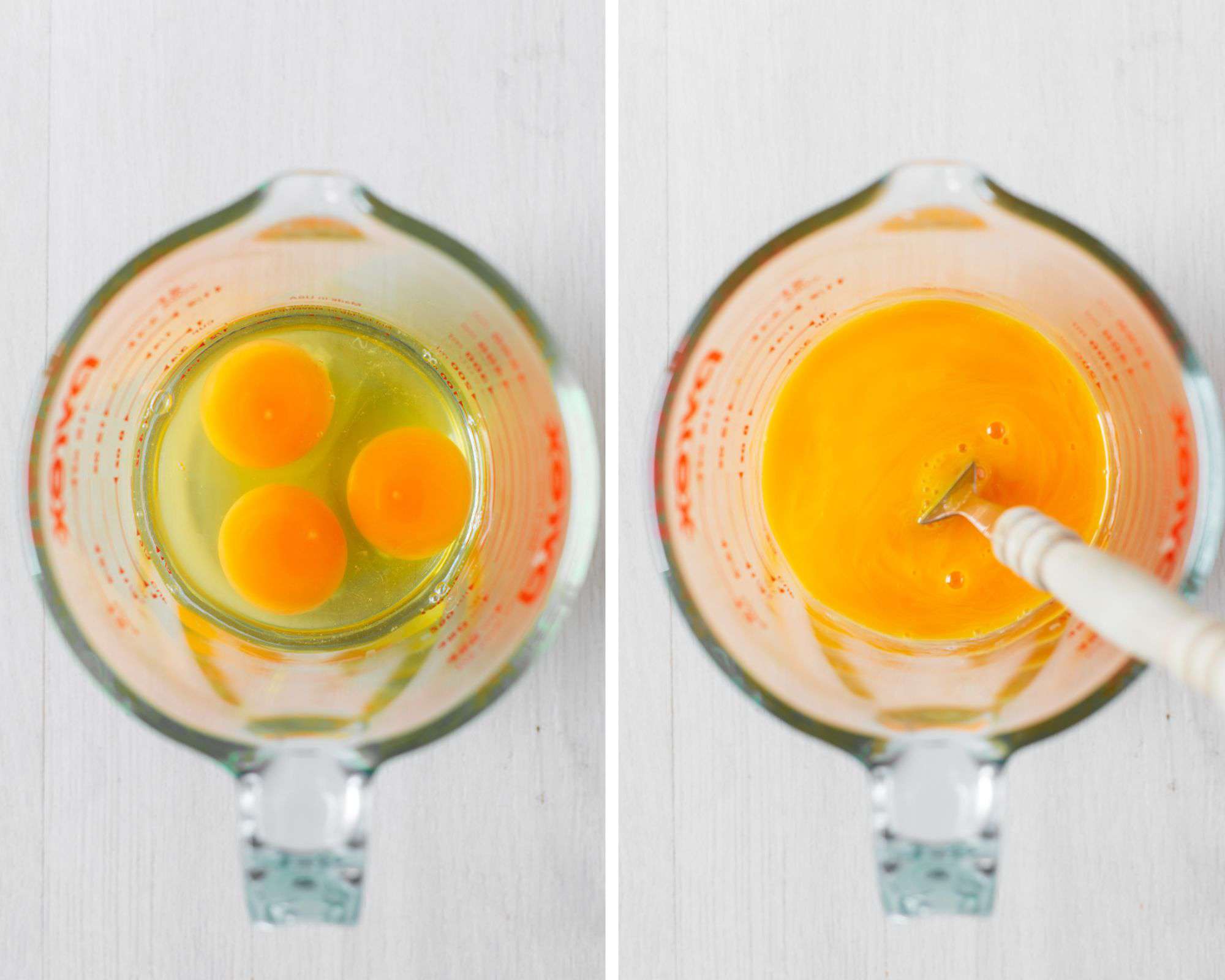 Eggs whisked in glass jug.