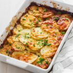 Easy potato bake in white baking dish.
