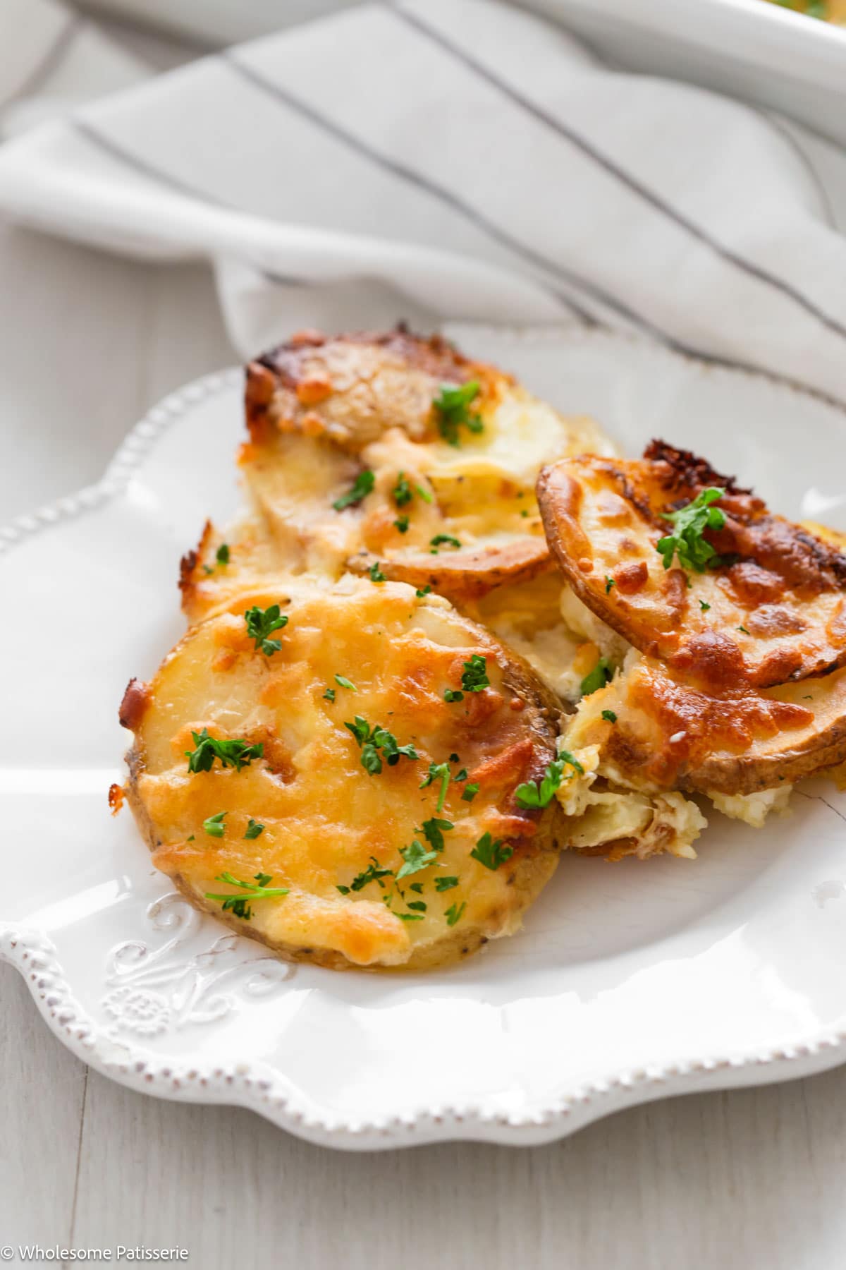 Easy potato bake served on white plate.