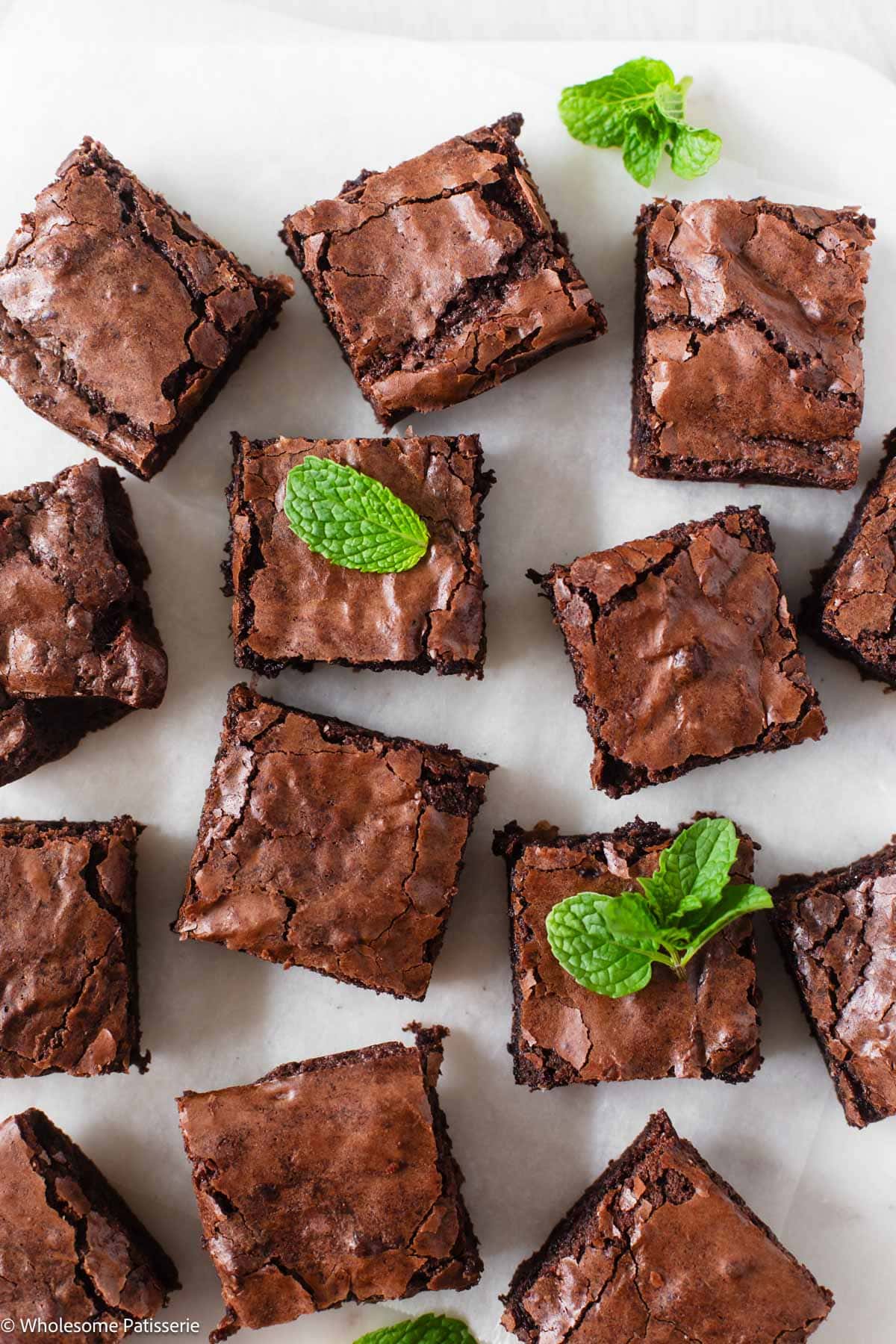 Box brownies cut into squares and served on marble platter with fresh mint leaves.