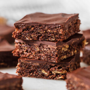 A stack of chocolate weetbix slice squares.