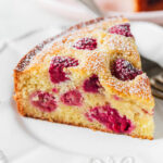 Vanilla raspberry cake on plate.