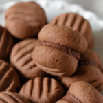 Chocolate yo yo biscuits stacked together.
