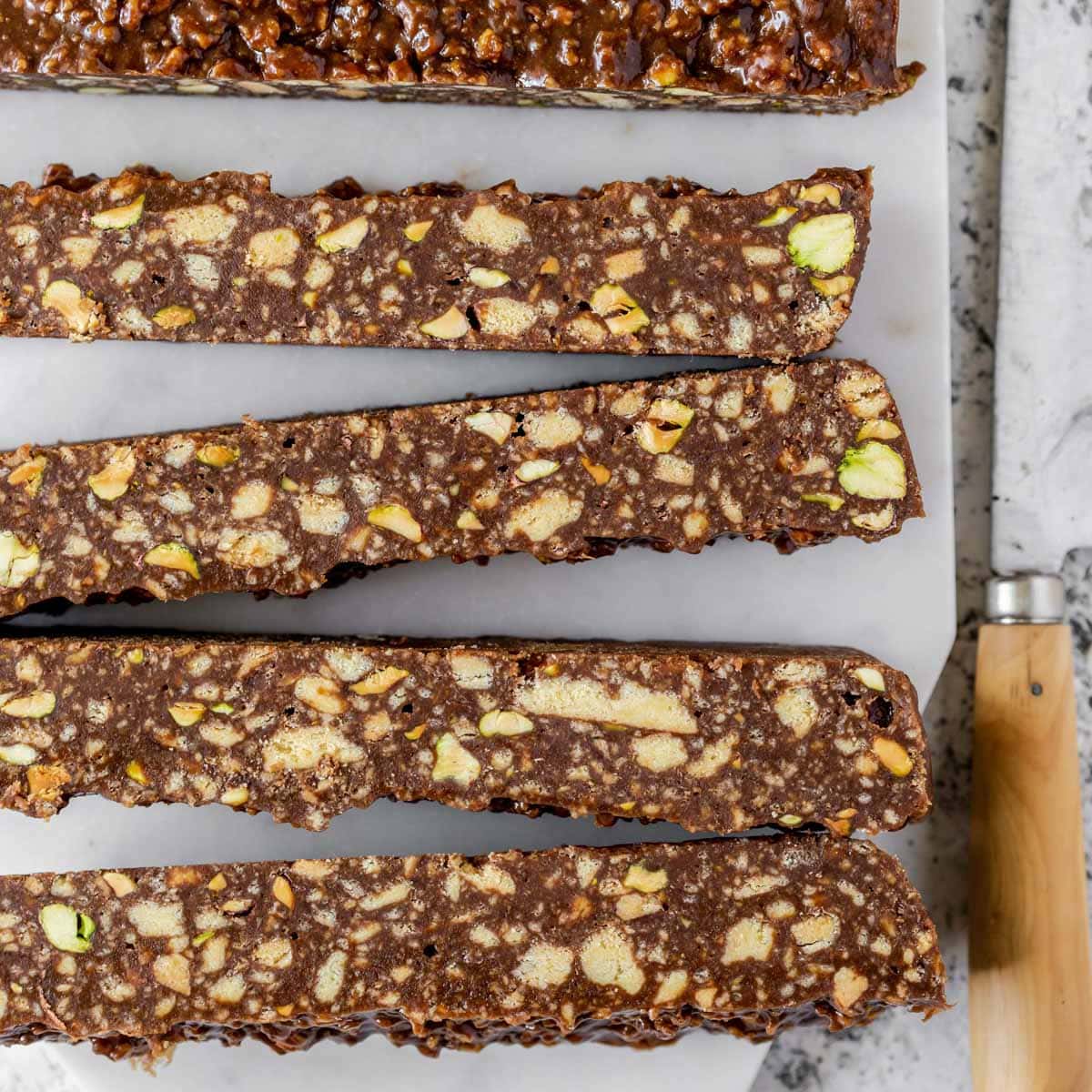 Orange pistachio hedgehog slice cut into long bars.