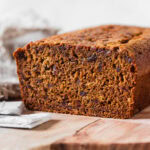 Black tea date loaf cut in half.