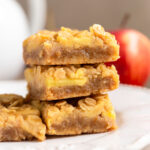 Easy caramel apple bars in a stack on a plate.