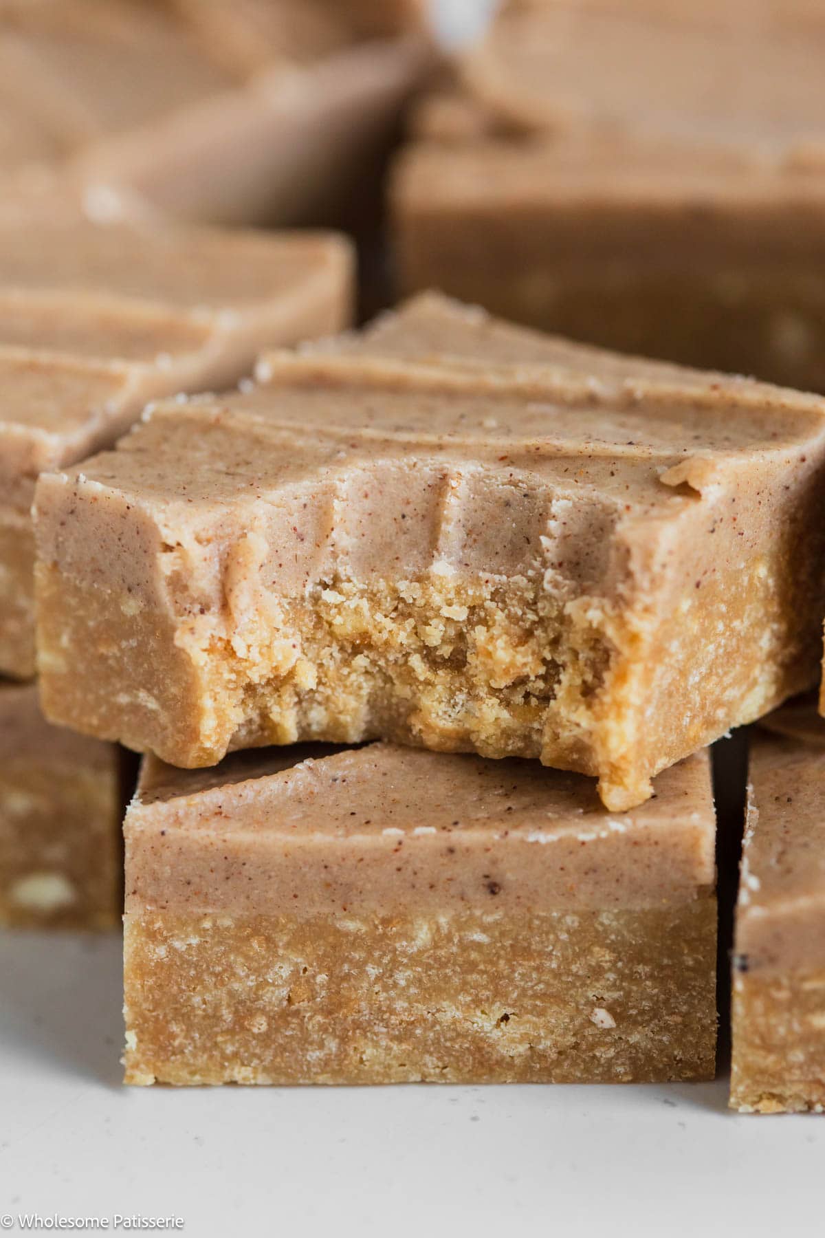 A bite taken out of one square of pumpkin spice bar square.