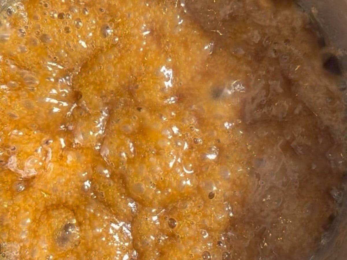 Boiling butter and sugar in saucepan.