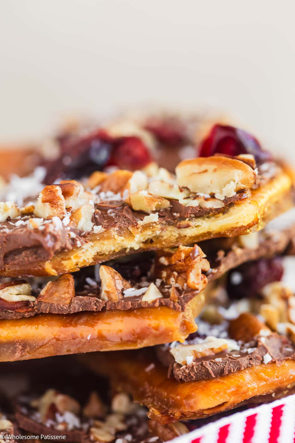 Bite taken out of a piece of christmas crack.