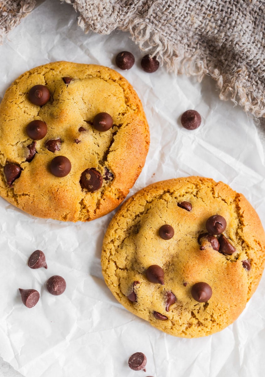 Chocolate chip cookies for two on parchment paper.